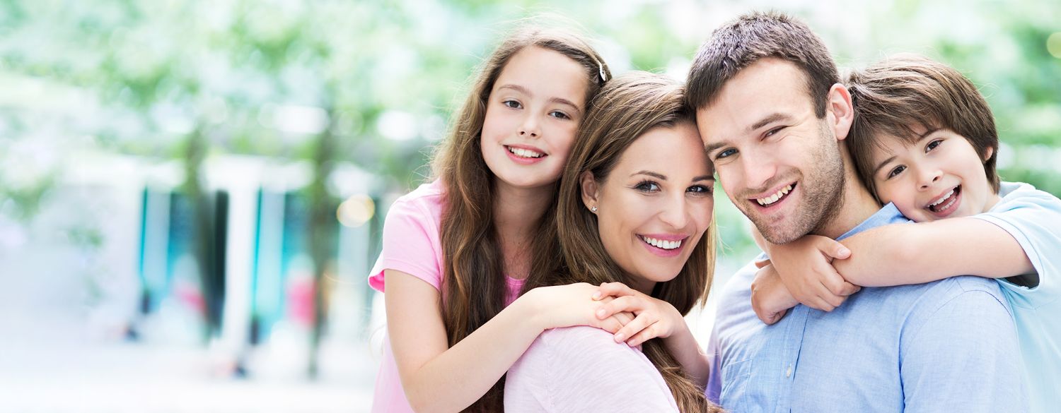 Family with bright, healthy smiles — cosmetic dentistry in Chanhassen, MN